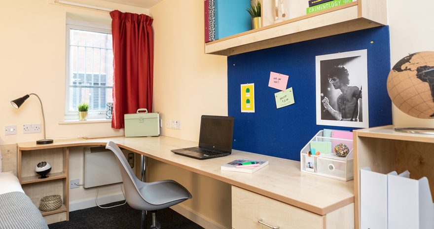 a close up of desk and shelves in the classic ensuite at albert court