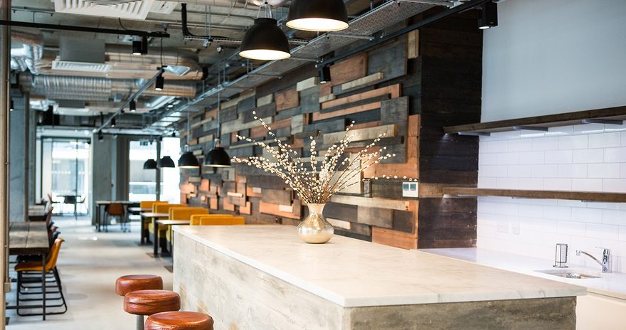 A social space with stools and a stone table at chapter lewisham