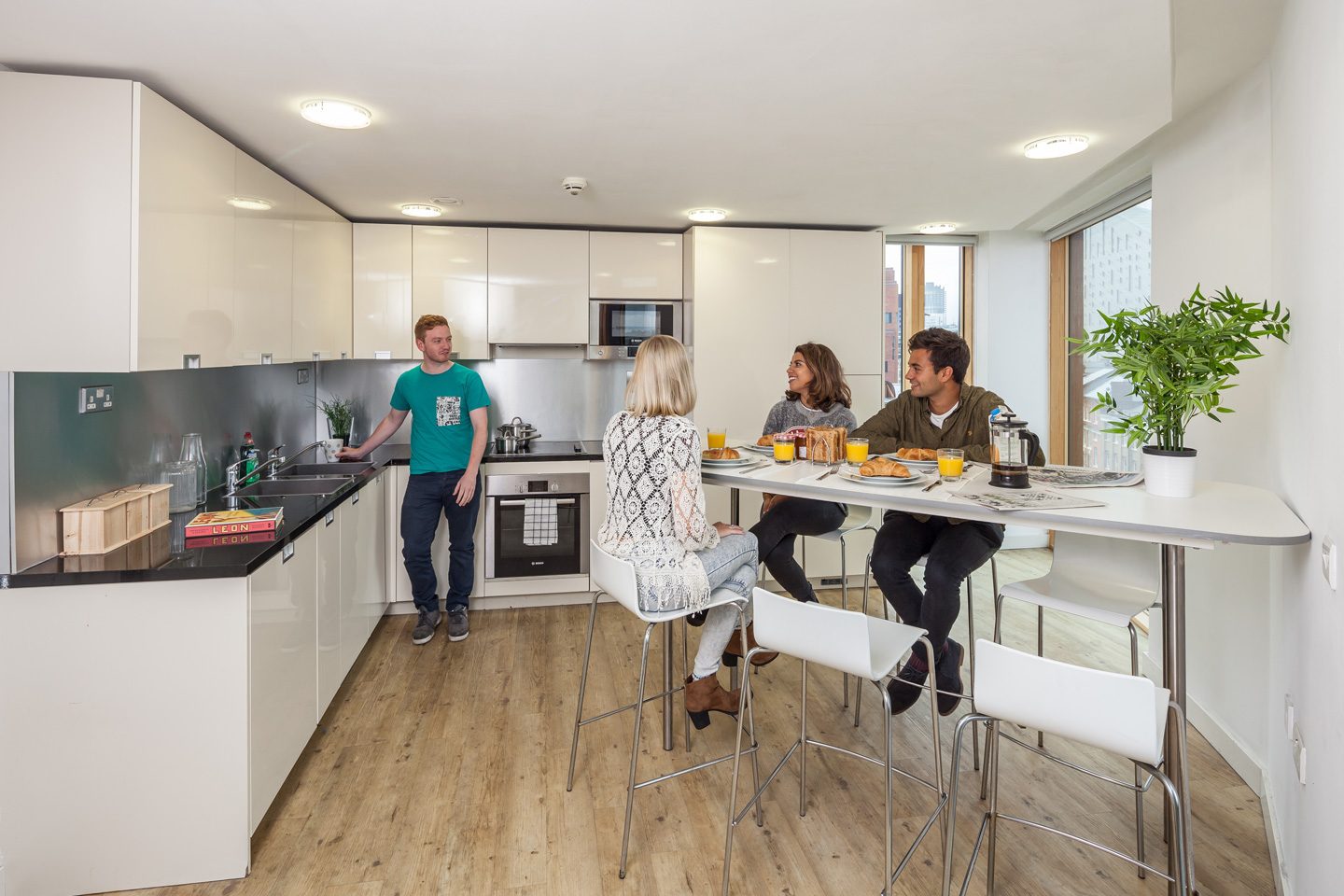 Student in a fully equipped shared kitchen at the Urbanest Hoxton accommodation
