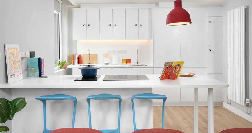 A shared kitchen showing the worktop and cupboards in the background