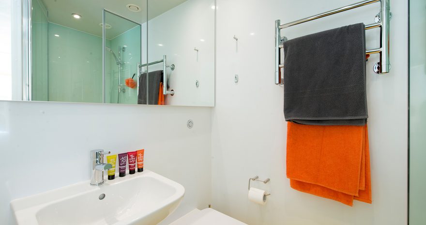 Bathroom at Scape Shoreditch featuring washbasin, toilet and shower cubicle