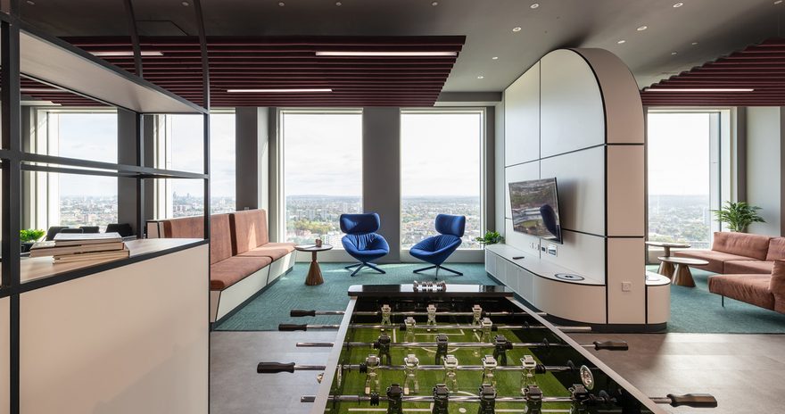 Social space on the 37th floor at Vega with with pool table and views over London