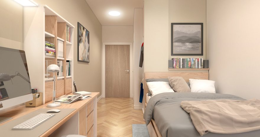 the interior of a classic ensuite with a bed on the right and a study desk with shelves on the left